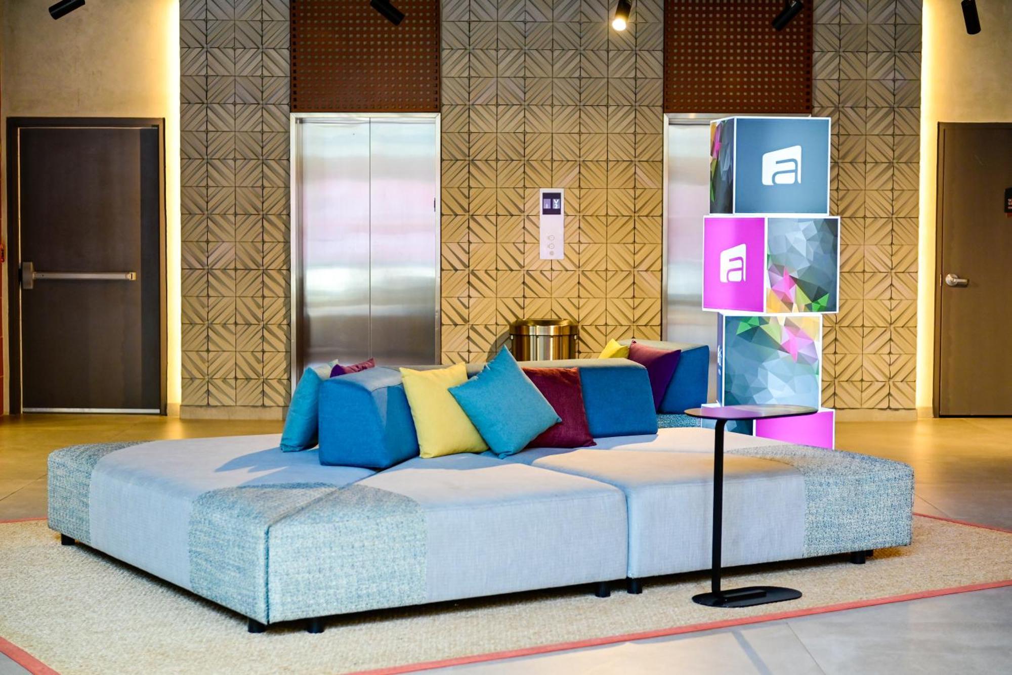 Отель Aloft Плая-дель-Кармен Экстерьер фото The lobby of the hotel